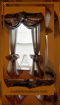 a picture of a curtain with a bow on it